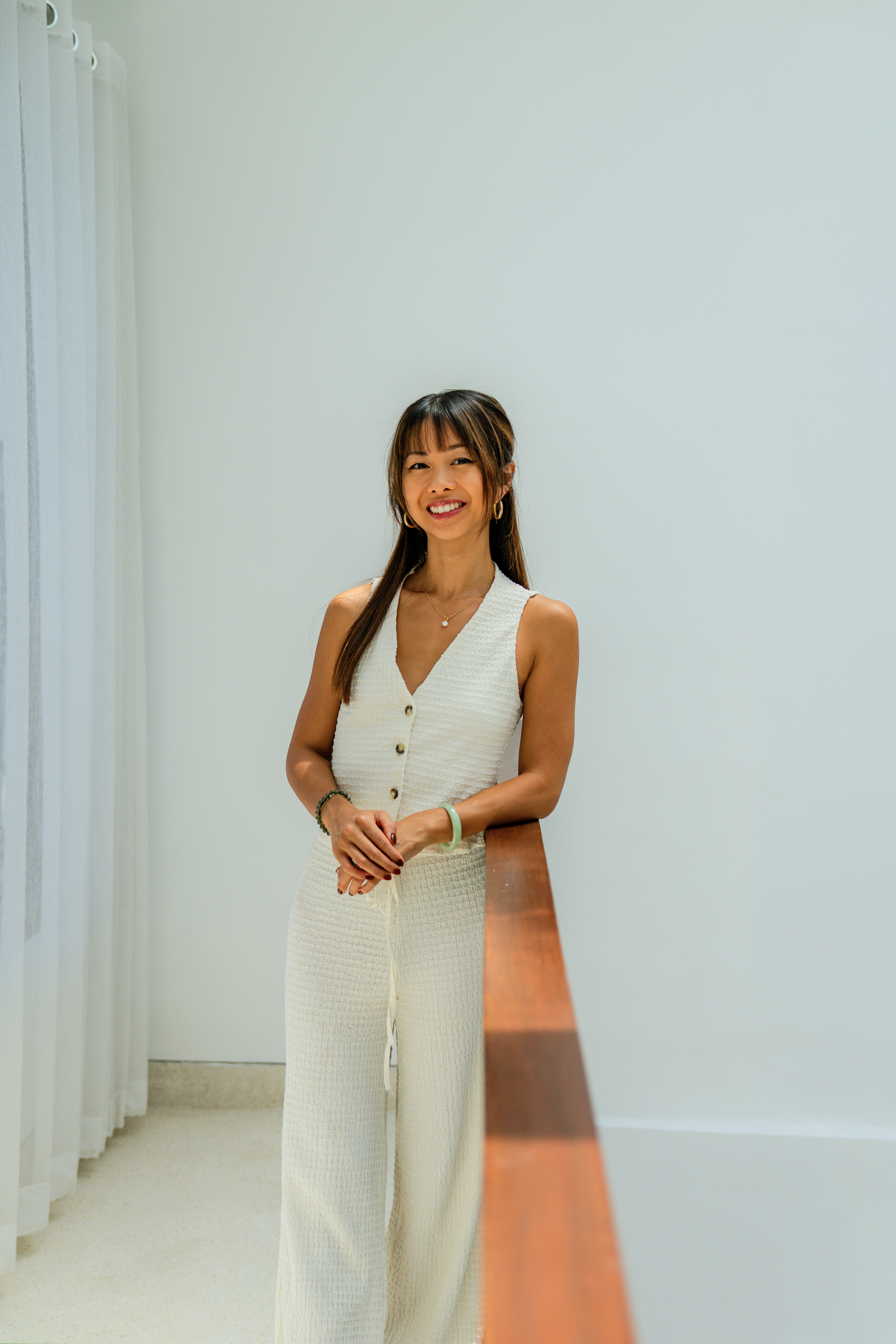 Laura Lam smiling during a consultation